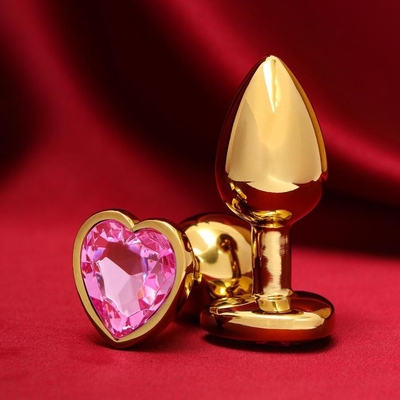 Золотистая анальная пробка с розовым кристаллом в форме сердца - 7 см. - фото, цены