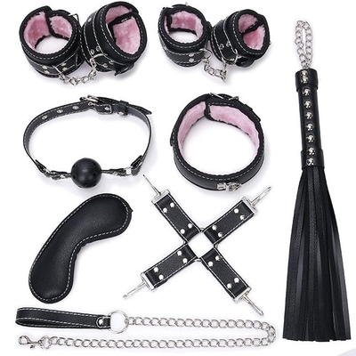 Пикантный черно-розовый набор бдсм: маска, ошейник, кляп, фиксатор, наручники, оковы, плеть - фото, цены