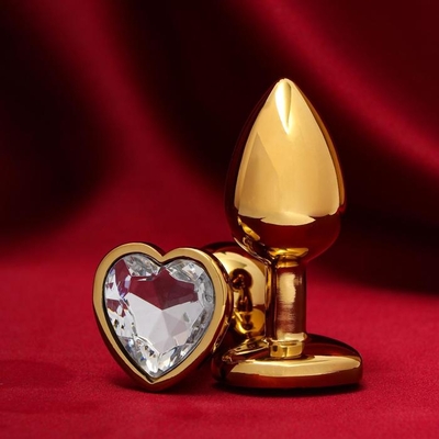 Золотистая анальная пробка с прозрачным кристаллом в форме сердца - фото, цены