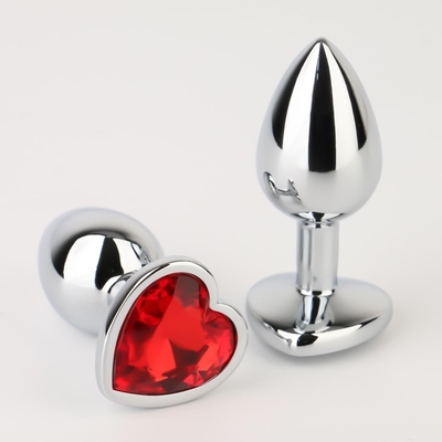 Серебристая анальная пробка с красным кристаллом в форме сердца - 7 см. - фото, цены