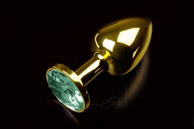 Маленькая золотистая анальная пробка с круглым кончиком и изумрудным кристаллом - 7 см. - фото, цены