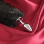 Серебристая анальная втулка с черным хвостиком