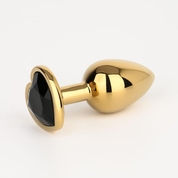 Золотистая анальная пробка с черным кристаллом в форме сердца - 7 см. - фото, цены