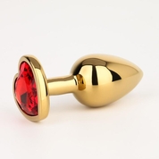 Золотистая анальная пробка с красным кристаллом в форме сердца - 7 см. - фото, цены