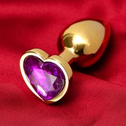 Золотистая анальная пробка с фиолетовым кристаллом в форме сердца - фото, цены
