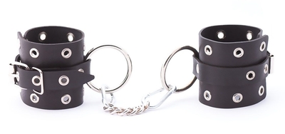 Черные кожаные наручники с люверсами - фото, цены