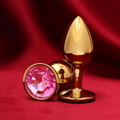 Золотистая анальная пробка с розовым кристаллом - фото, цены