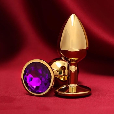 Золотистая анальная пробка с фиолетовым кристаллом - фото, цены