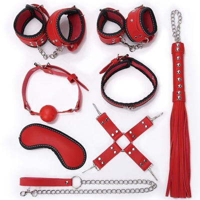 Пикантный красно-черный набор бдсм: маска, ошейник, кляп, фиксатор, наручники, оковы, плеть - фото, цены